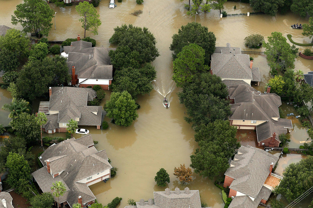 (Brett Coomer/Houston Chronicle via AP)