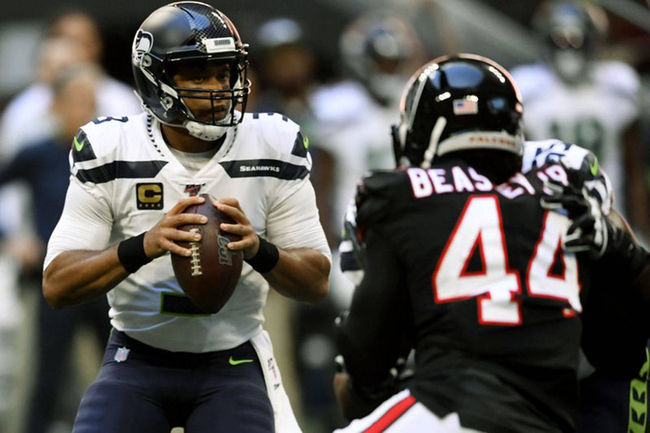 Con 2 pases de touchdown de Wilson, Seattle frena a Atlanta