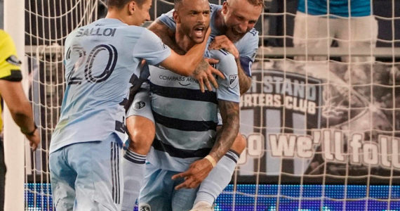 May 10, 2022; Kansas City, Kansas, USA; Sporting Kansas City forward Khiry Shelton (11) celebrates with forward Dániel Salloi (20) and forward Johnny Russell (7) after scoring against FC Dallas during extra time at Children's Mercy Park. Mandatory Credit: Denny Medley-USA TODAY Sports