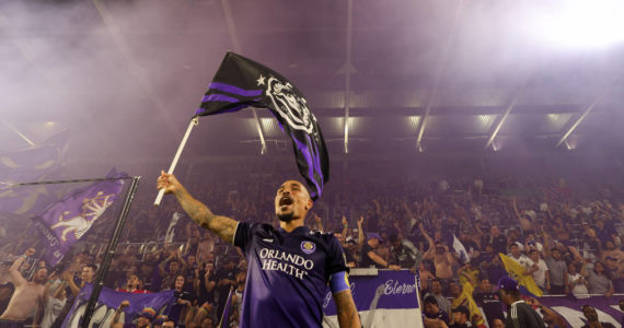May 25, 2022; Orlando, Florida, USA; Orlando City midfielder Junior Urso (11) celebrates with fans after beating Inter Miami in a US Open cup game at Exploria Stadium. Mandatory Credit: Nathan Ray Seebeck-USA TODAY Sports