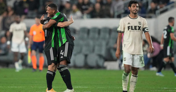 May 18, 2022; Los Angeles, California, USA; Austin FC forward Jon Gallagher (17) and defender Ruben Gabrielsen (4) celebrate after the game as LAFC forward Carlos Vela (10) reacts at Banc of California Stadium. Mandatory Credit: Kirby Lee-USA TODAY Sports