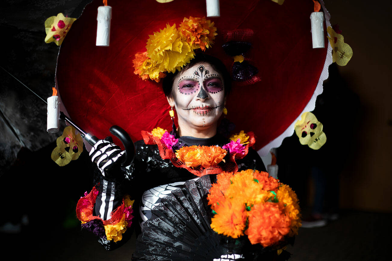 Silvia Rodriguez poses for a portrait after winning best catrina at the Washington-Guerrero Foundation’s Día de los Muertos event at the Lynnwood Convention Center on Saturday, Oct. 29, 2022. (Olivia Vanni / The Herald)