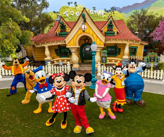 Mickey Mouse, Minnie Mouse and their pals pose in the newly reimagined Mickey's Toontown at Disneyland Park in Anaheim, Calif. For the first time at any Disney park, Pete also makes appearances as he causes mischief around the neighborhood. Mickey Mouse sports a new outfit specifically for when he is greeting guests outside of his home. At this animated neighborhood, families can explore, play, discover and unwind together while enjoying new interactive experiences, returning familiar favorites and the new attraction Mickey & Minnie’s Runaway Railway. (Christian Thompson/Disneyland Resort)