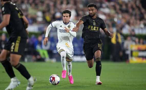 Jul 4, 2023; Los Angeles, California, USA; LA Galaxy midfielder Riqui Puig (6) and LAFC midfielder Timothy Tillman (11) battle for the ball in the second half at the Rose Bowl. Mandatory Credit: Kirby Lee-USA TODAY Sports