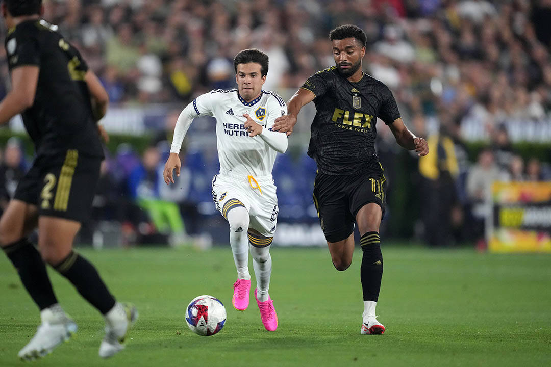 Jul 4, 2023; Los Angeles, California, USA; LA Galaxy midfielder Riqui Puig (6) and LAFC midfielder Timothy Tillman (11) battle for the ball in the second half at the Rose Bowl. Mandatory Credit: Kirby Lee-USA TODAY Sports